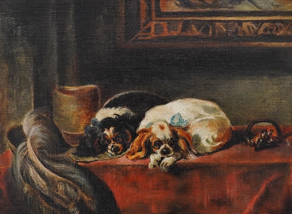 Early 20th century English School, oil on canvas, Study of two Cavalier King Charles spaniels in an interior, 21 x 29cm, gilt framed. Condition - fair to good, general craquelure throughout